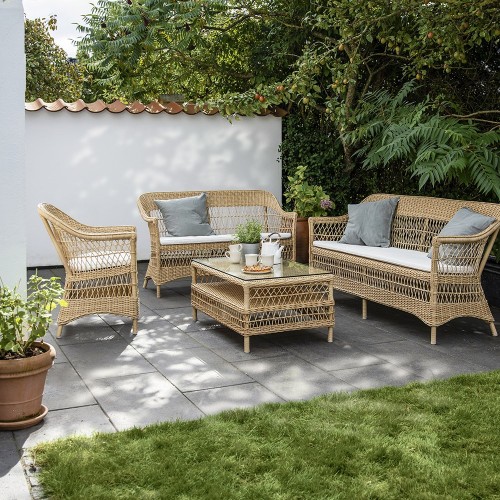 Charlot armleunstoel naturel met zitkussen Sika Design